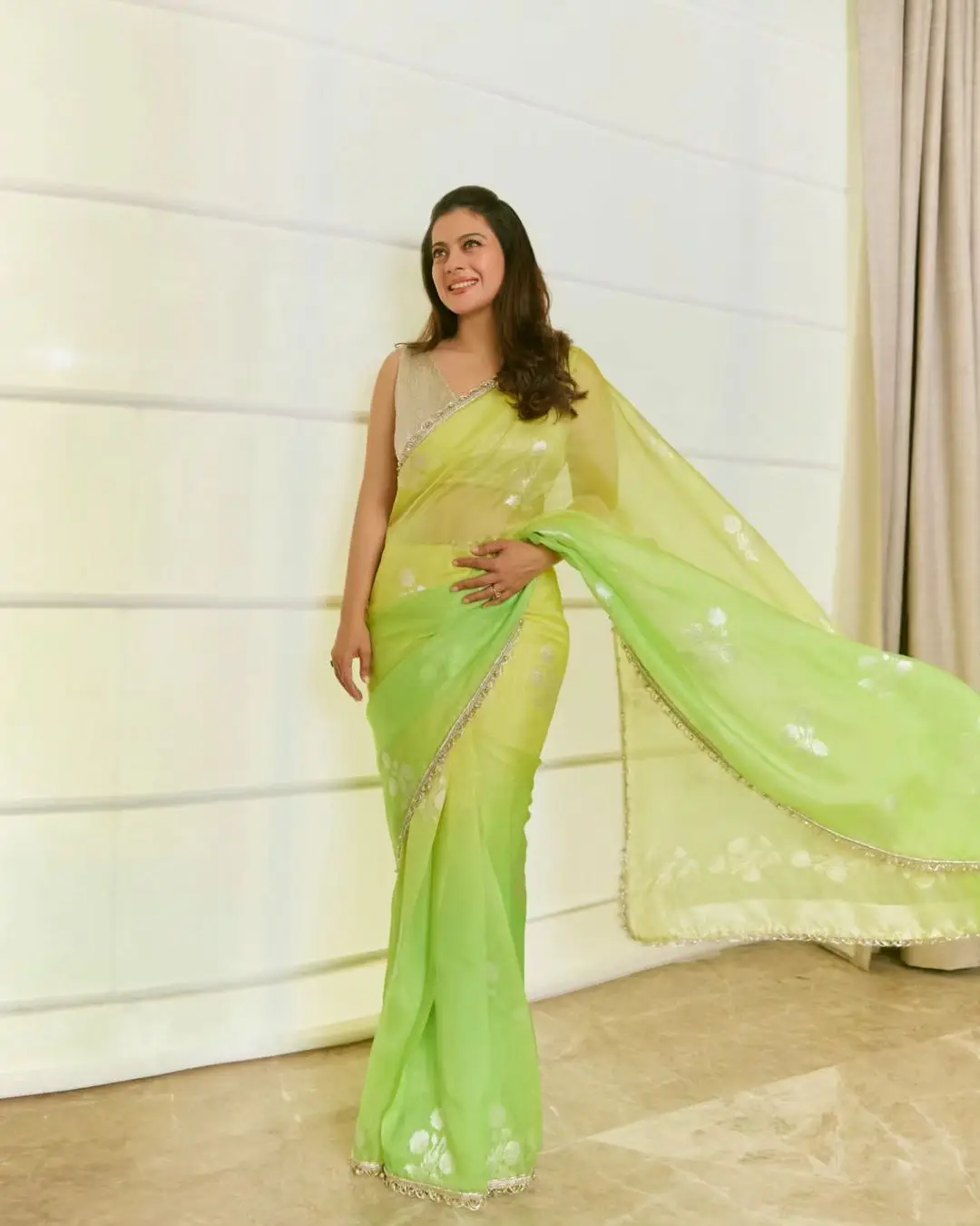 Kajol Devgan Photos In Lemon Green Saree Sleeveless Blouse